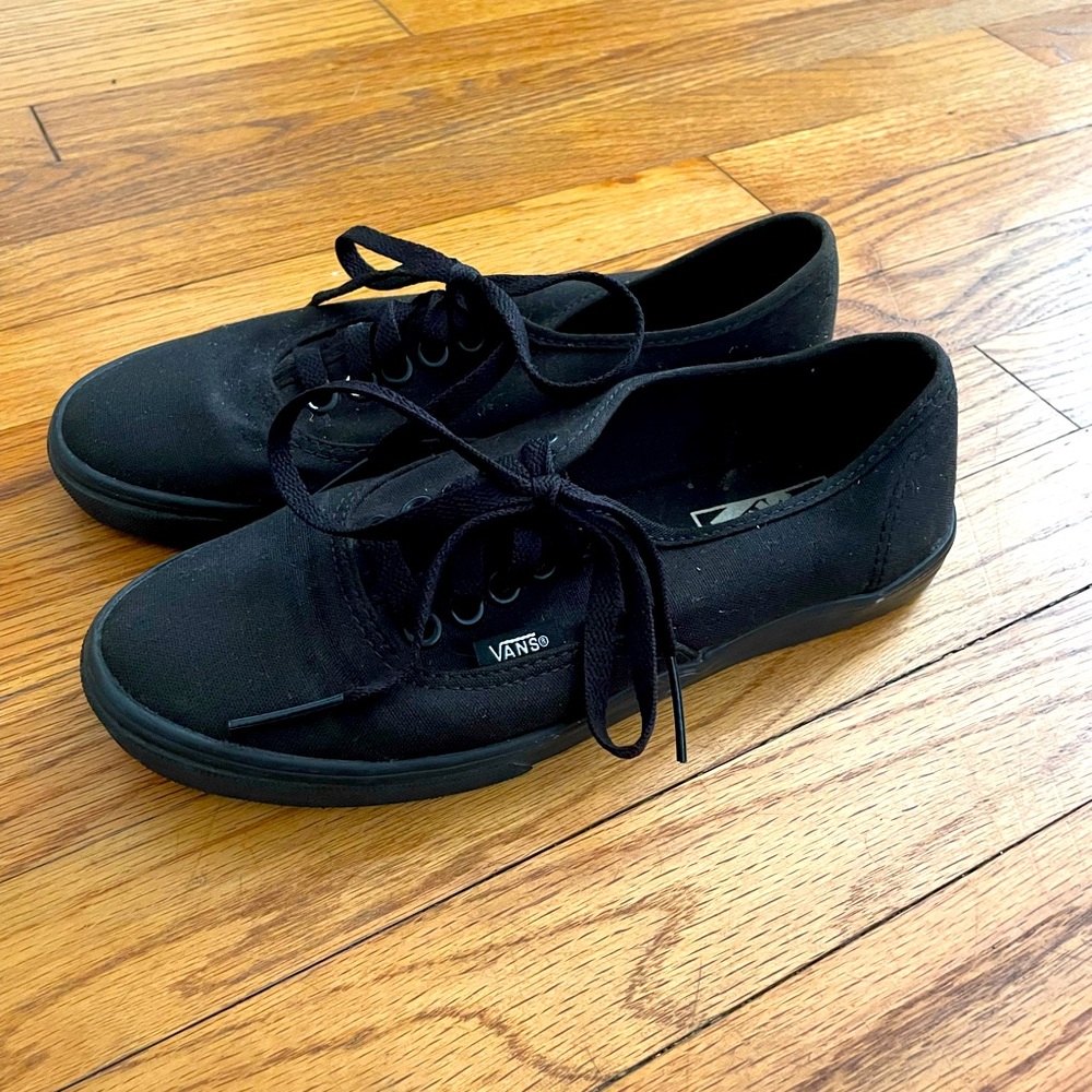 All black Vans low top deck shoes